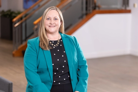 portrait of a smiling person in professional attire